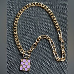 LIARS & LOVERS GOLD TONE NECKLACE WITH PINK SQUARE PLATE & SPARKLY GREEN STONES